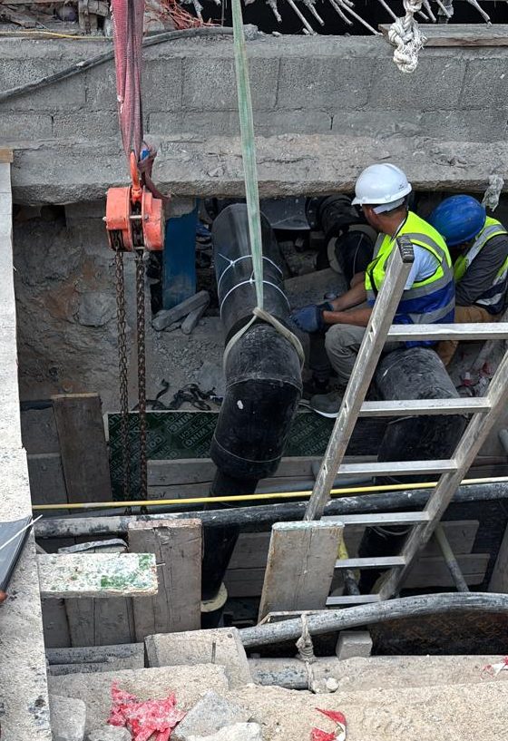Field joint insulation work on underground chilled water pipeline in Abu Dhabi