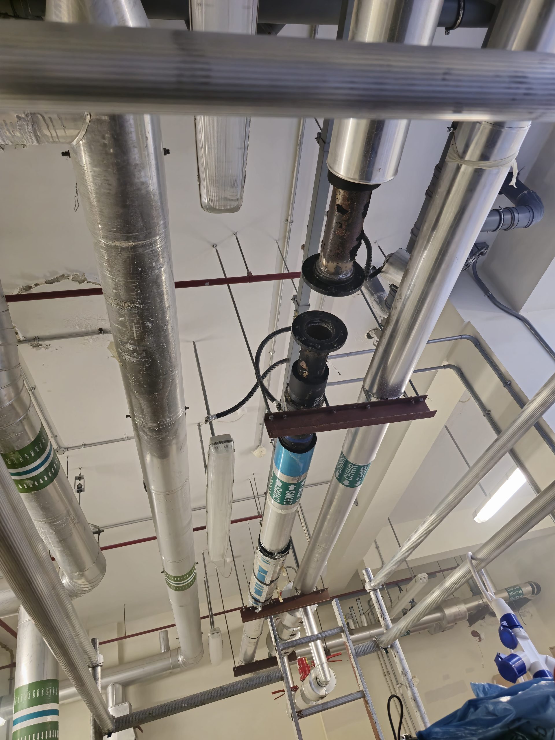 Pipeline preparation for electromagnetic chilled water flow meter installation in ETS room Abu Dhabi
