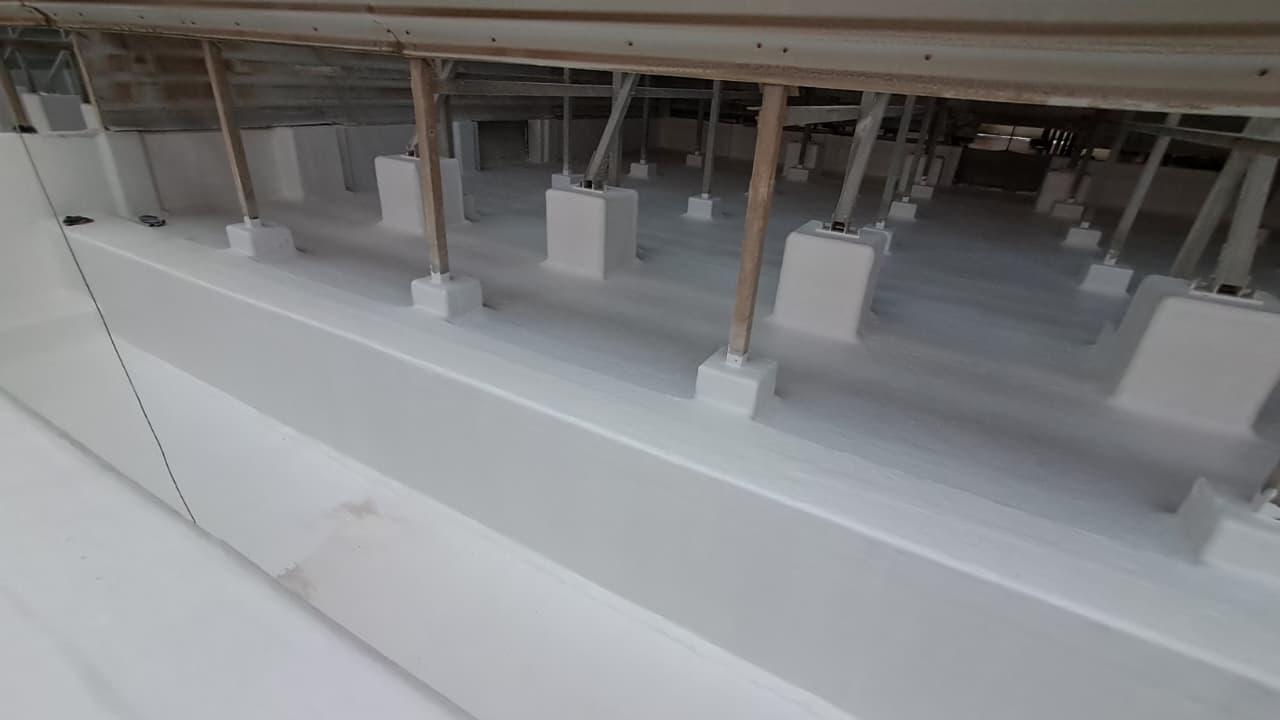Cooling tower basin GRP repair lamination and protective finishing